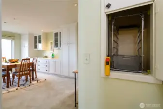 Dumbwaiter comes up from the garage to between the kitchen and the dining room