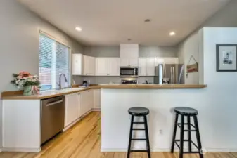 Upper level Floor 2 kitchen includes plenty of cabinet storage, counter space, and includes all stainless steel appliances.