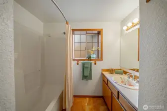 Main hall bathroom features a custom made sink from an Olympia Farmer's Market craftsman.