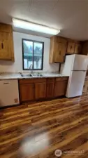Move in ready!! enjoy all the new appliances in this open well designed kitchen.  new: Range refrigerator dishwasher PLUS new stainless sink with New Kohler faucets & countertop.New over head lighting over range and Sink.