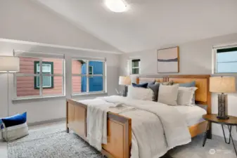 On the 3rd floor, vaulted ceilings add space to an already roomy primary bedroom.