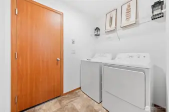 Right across from the bathroom is your utility room with brand new washer and dryer, leading into your garage space.