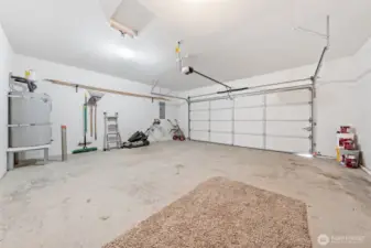 Two car garage with ample storage space.