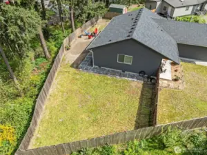 Ample level backyard space, more than enough room for a garden, toys or entertaining. original grass, not photo enhanced.