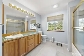 Primary bathroom with natural light.