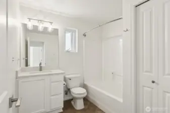 Well-appointed full bathroom with sleek finishes and built-in storage—combining everyday function with clean, modern style.