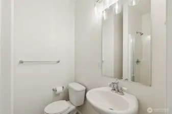 Stylish main-level full bathroom features updated finishes and convenient access—ideal for guests or everyday use with a clean, modern aesthetic.