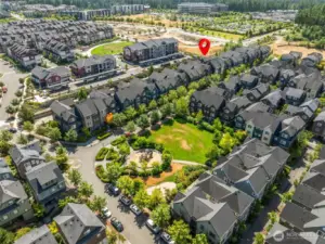 Elevated exterior view highlights the home’s prime location within Issaquah Highlands—just steps from parks, trails, shopping, and vibrant community amenities.