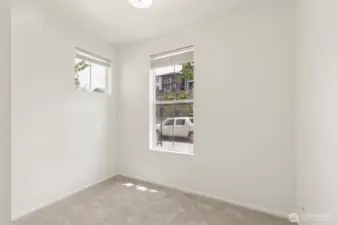 This adaptable entry-level space offers endless possibilities—ideal for a home office, workout room, creative studio, or private guest retreat with nearby full bath.