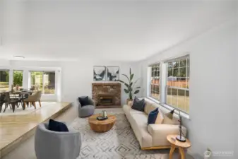 Welcome! This home features a sunken living room and overlooks the lush front yard. The spacious layout provides ample natural light, creating a warm and inviting atmosphere.