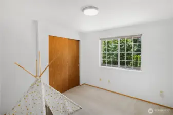 Third bedroom, at the top of stairs, upper level. This shows the large, two door closet.