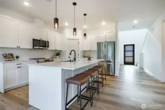 Photos shown are of a similar floor plan previously built in a different neighborhood (The Ridge in Blaine). Finishes and features may vary. Some items pictured reflect buyer-selected upgrades which are not included in the base price and may be added at an additional cost.