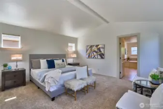 Upon going up the stairs you are greeted by French doors leading into the primary suite