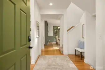 View though the foyer. Note the hardwood floors. The home enjoys heating and cooling with a furnace and high efficiency heat pump.