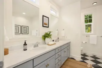 The primary bath with shower and soaking tub.