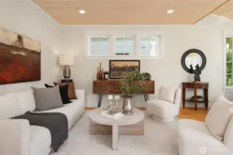 The comfortable living room overlooks the dining room and the cook's kitchen.