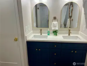 Primary Double sink with Linen Closet on the left
