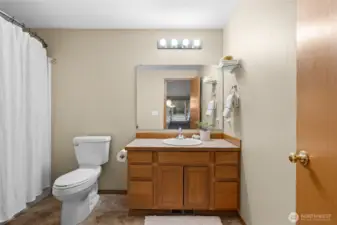 A large bathroom perfectly positioned in the center of the home for easy access.
