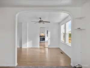 Original touches include arched entry to dining room and high ceilings.