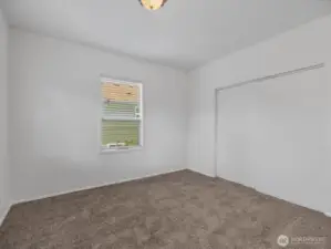 Main floor bedroom with big closets. Each of the two bedrooms on this level has new carpeting.