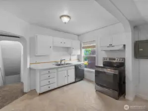 The upper level kitchen includes all appliances.