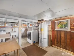 The basement has loads of work and storage space.