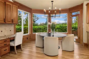 A lovely space for casual dining adjoins the spacious deck and showcases the newly refinished floors. The built in desk and cabinets provide a place for keys, mail and any other items that need a special landing.