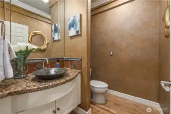 The elegant powder room on the main floor boasts lovely designer finishes.