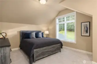 Upper bedroom #four has vaulted ceilings.