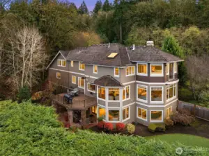 A view of this truly magnificent NW estate home from the back. Fine wood trim and architectural detail, in and out.