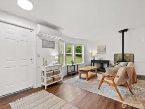 Entry way into living room with pellet stove