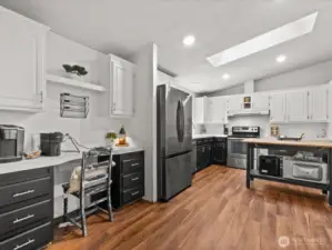 Kitchen with desk area. All appliances stay.