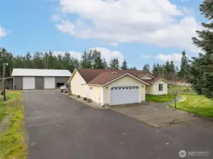 Custom built home, shop, paved driveway and parking