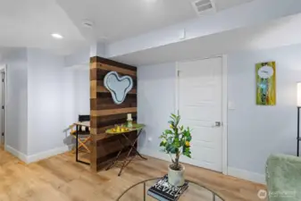 The entrance to the primary suite is a luminous transition, expertly color-drenched in Mild Blue to create an immediate sense of calm.