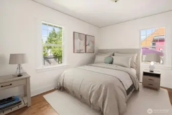 Main floor bedroom, newly refinished beautiful hardwood floors.