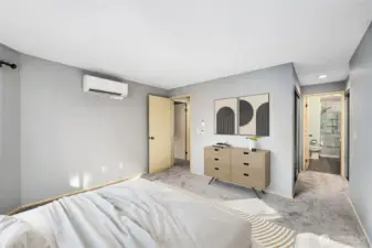 Primary Suite   Large space with view windows  Mitsubishi mini split for heat and A/C installed March 2024  Dual closets with mirrored doors.  Virtually Staged