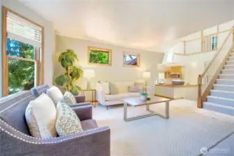 This is where it happens!  Bay window from the Family Room to take in the beauty of the trees, a clear line of sight to keep up with the cook, and an open staircase separating the Family Room from the Sleeping Rooms.