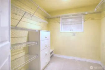 One of two closets in the Primary Suite dressing area. Plenty of room for all of your clothes and accessories.