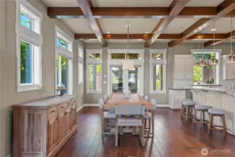 Flowing hardwoods and large windows allow the outside in