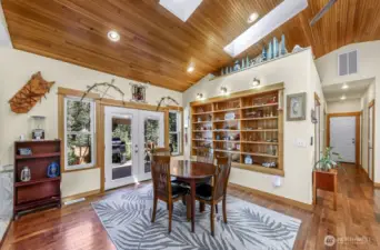 Dining room with built-ins and access to the back deck