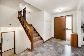 Entryway with storage just behind photographer