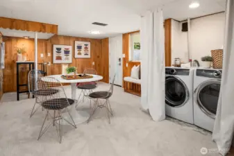 Lower level family room; on site laundry area plus door to the back yard