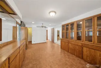 View from kitchen in the dining room. Primary bed and bath are down the hallway on the left
