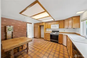 Kitchen that leads into the utility room