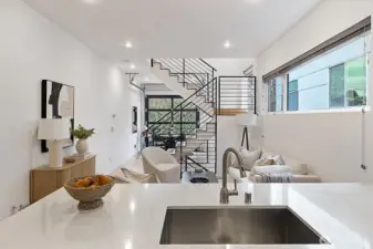 Undermount sink and floating shelves add to the urban, modern vibe!