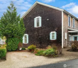 large side yard with parking and garden space.  Potential garage with carriage house above.
