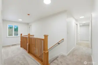 Upstairs landing with 2 bedrooms to the left, and 2 more past the office down the hall to the right.