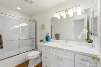 2nd completely remodeled bath with new everything ~ tub/shower with quartz surround and heavy duty glass sliding door, lighting, cabinets, toilet, counters, etc.