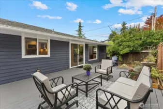 Picture yourself enjoying al-fresco summer meals on the sun-drenched deck, right off the kitchen slider.