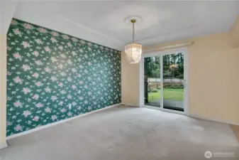 Formal dining room with sliding glass door access to the back patio